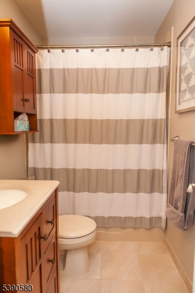 309 1st Street, Unit 3C Hoboken, NJ 07030 - Photo 12 of 12 a bathroom with a sink toilet and shower