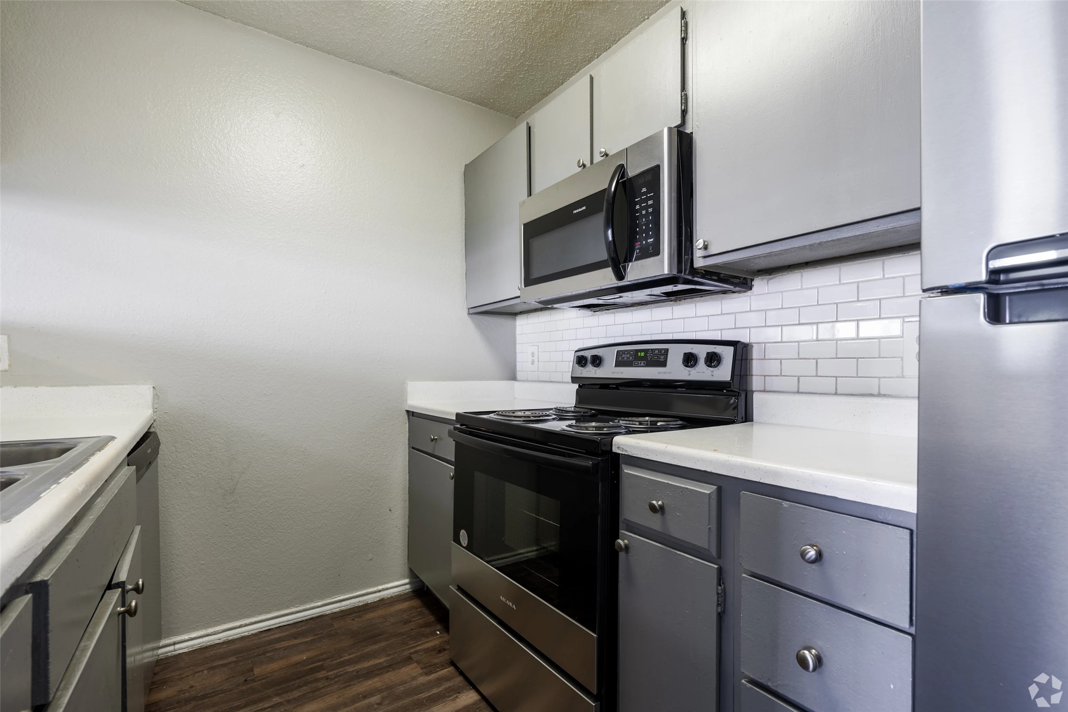 7610 Cameron Road, Unit 2016 Austin, TX 78752 - Photo 6 of 42 a kitchen with a stove microwave and sink