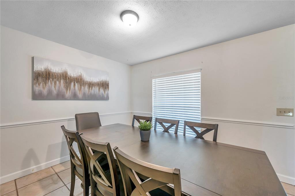 7405 Williams Road Seffner, FL 33584 - Photo 24 of 100 a view of a dining room with furniture