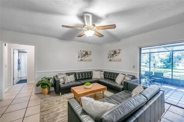 a backyard of a house with lots of green space and fountain