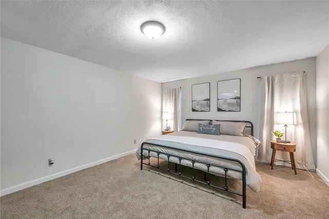 a kitchen with a stove a sink and a refrigerator