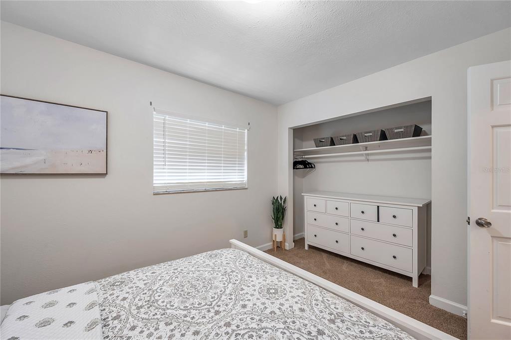 7405 Williams Road Seffner, FL 33584 - Photo 49 of 100 a view of a bedroom with baby bed and closet