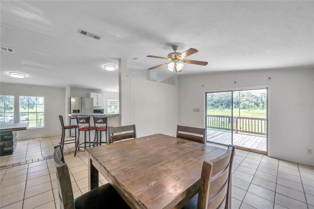 7405 Williams Road Seffner, FL 33584 - Photo 71 of 100 a view of a dining room with furniture window and outside view