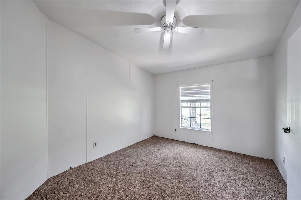 7405 Williams Road Seffner, FL 33584 - Photo 80 of 100 wooden floor in an empty room with a window