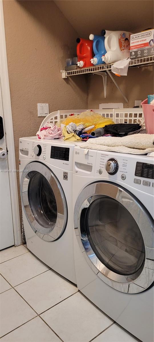 13661 Southwest 119th Avenue Miami, FL 33186 - Photo 11 of 36 a utility room with dryer and washer