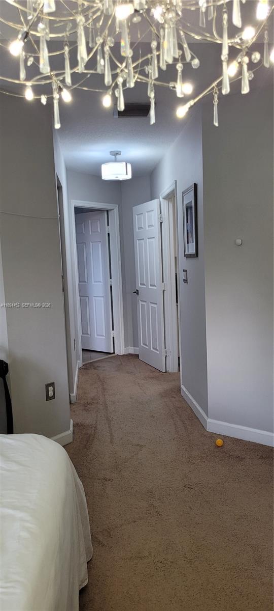 13661 Southwest 119th Avenue Miami, FL 33186 - Photo 13 of 36 a view of a livingroom with a chandelier
