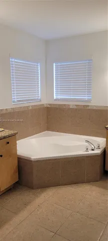 a bathroom with bathtub