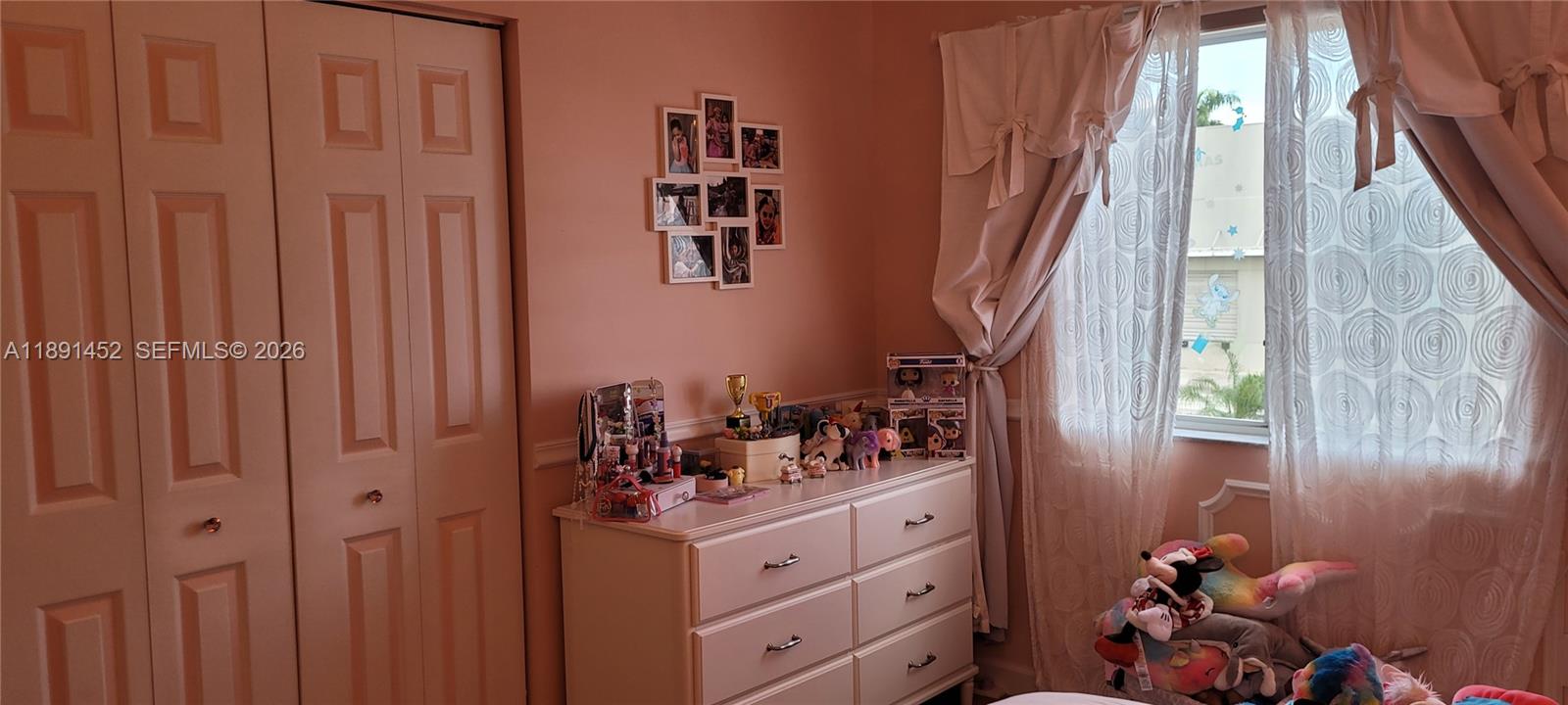 13661 Southwest 119th Avenue Miami, FL 33186 - Photo 21 of 36 a bathroom with a sink and mirror