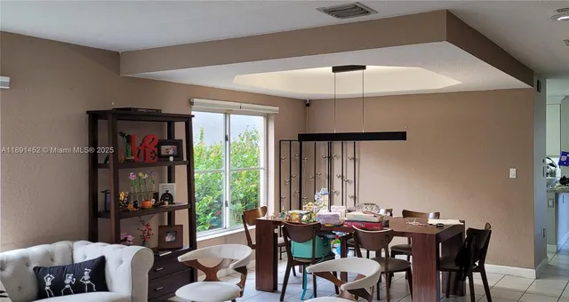 a view of a dining room with furniture window and outside view