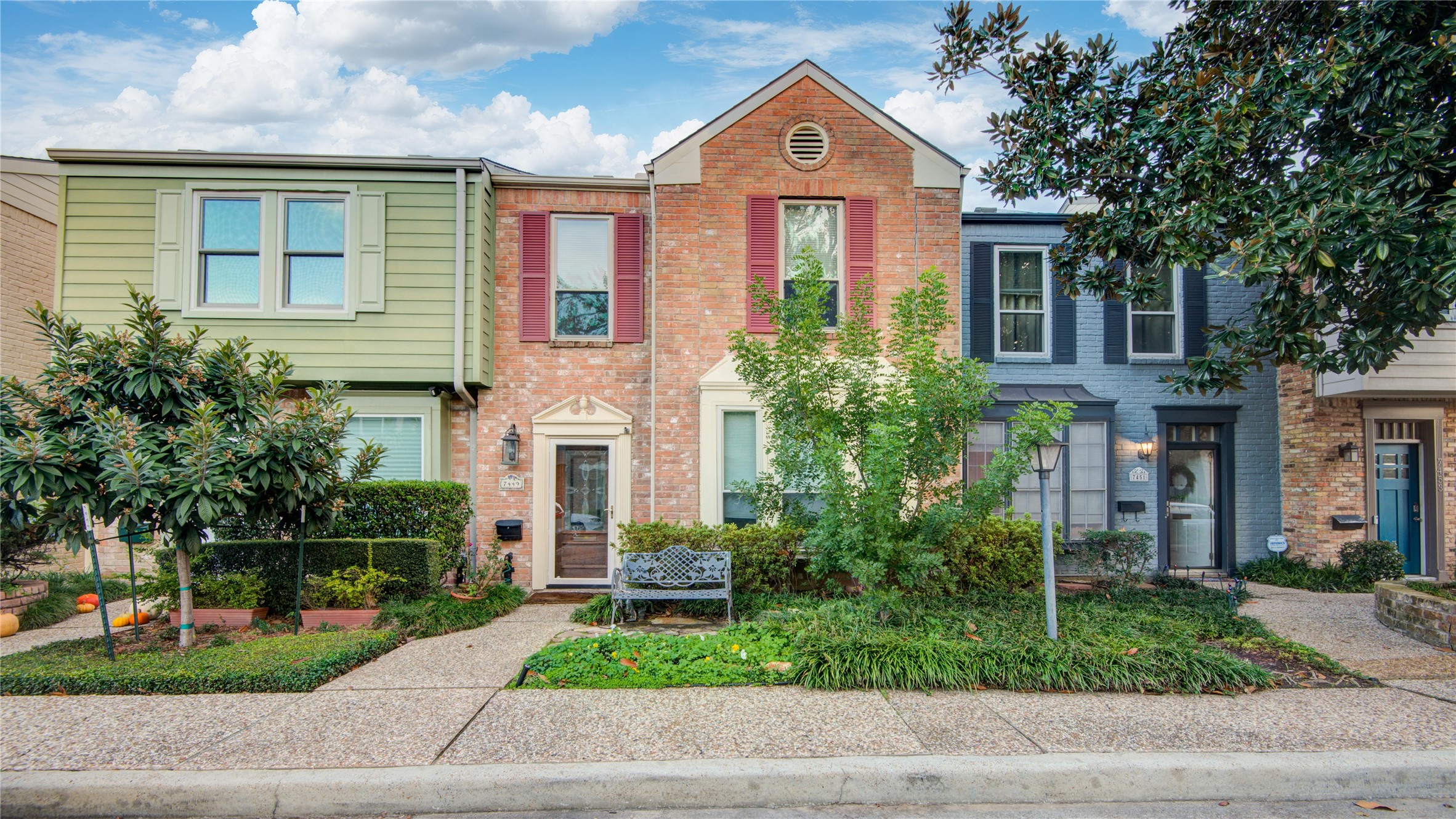 7449 Brompton Street, Unit 7449 Houston, TX 77025 - Photo 1 of 46 a front view of a house with garden