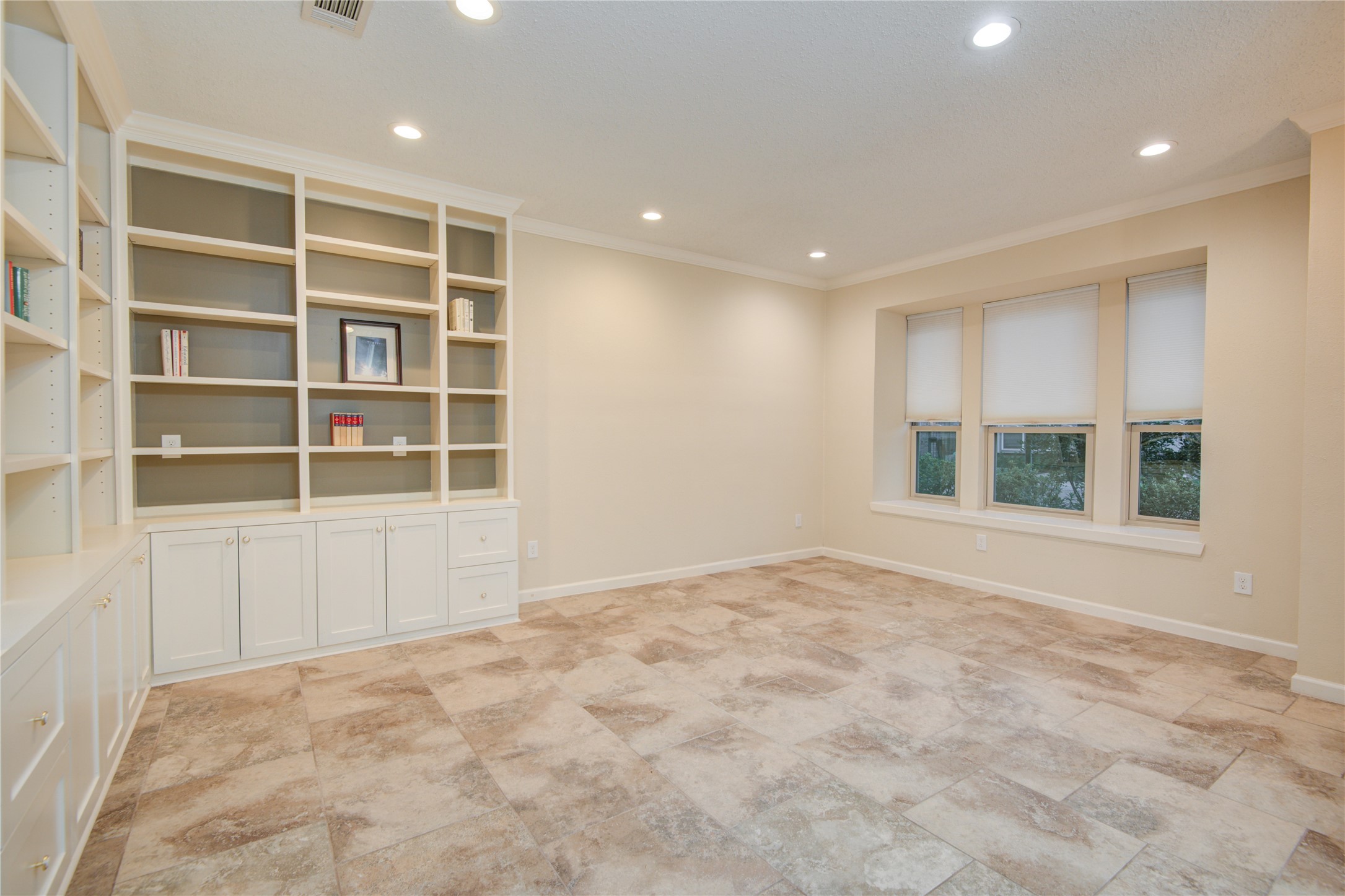 7449 Brompton Street, Unit 7449 Houston, TX 77025 - Photo 12 of 46 a view of an empty room with a window and closet