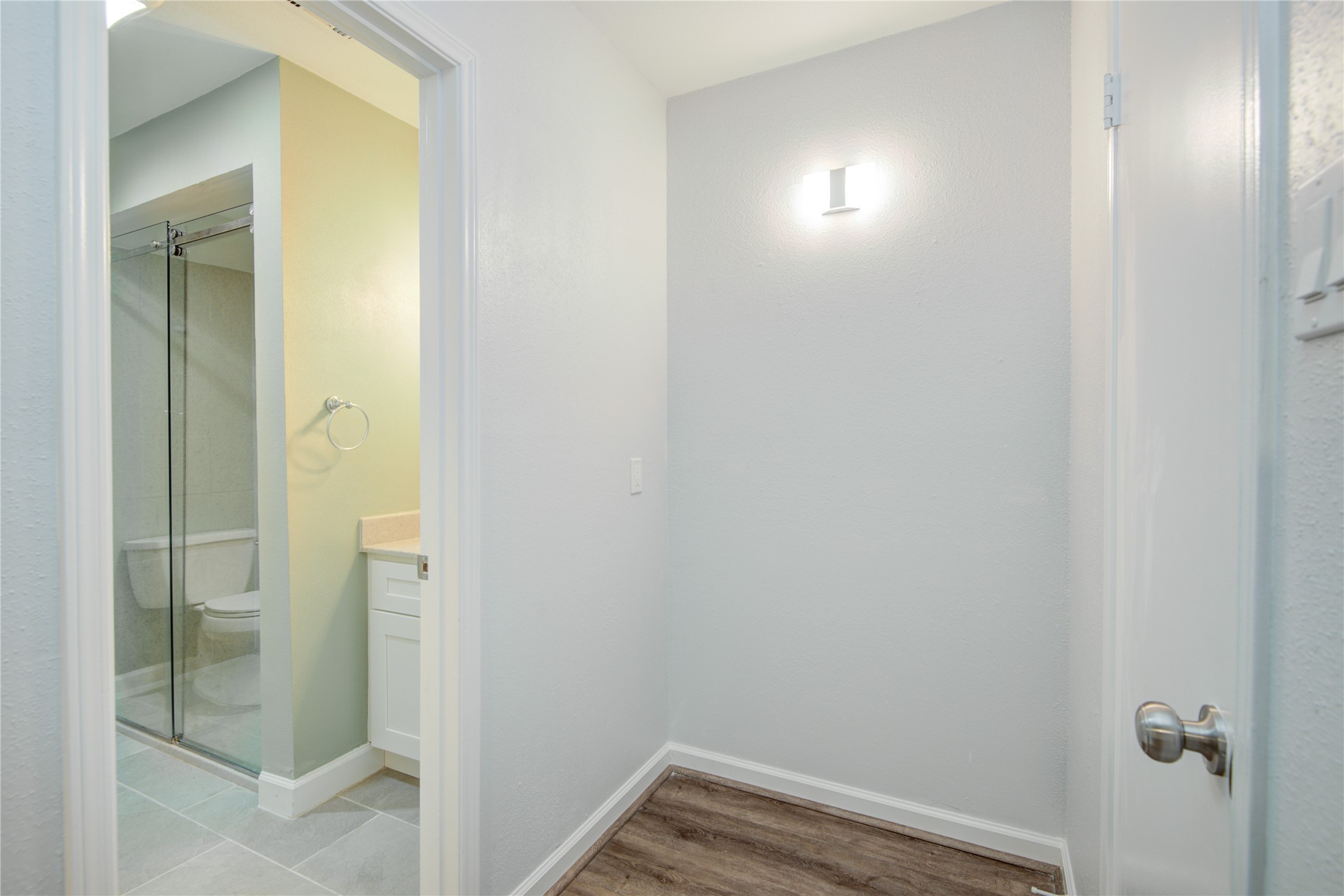 7449 Brompton Street, Unit 7449 Houston, TX 77025 - Photo 34 of 46 a view of a bathroom from a hallway