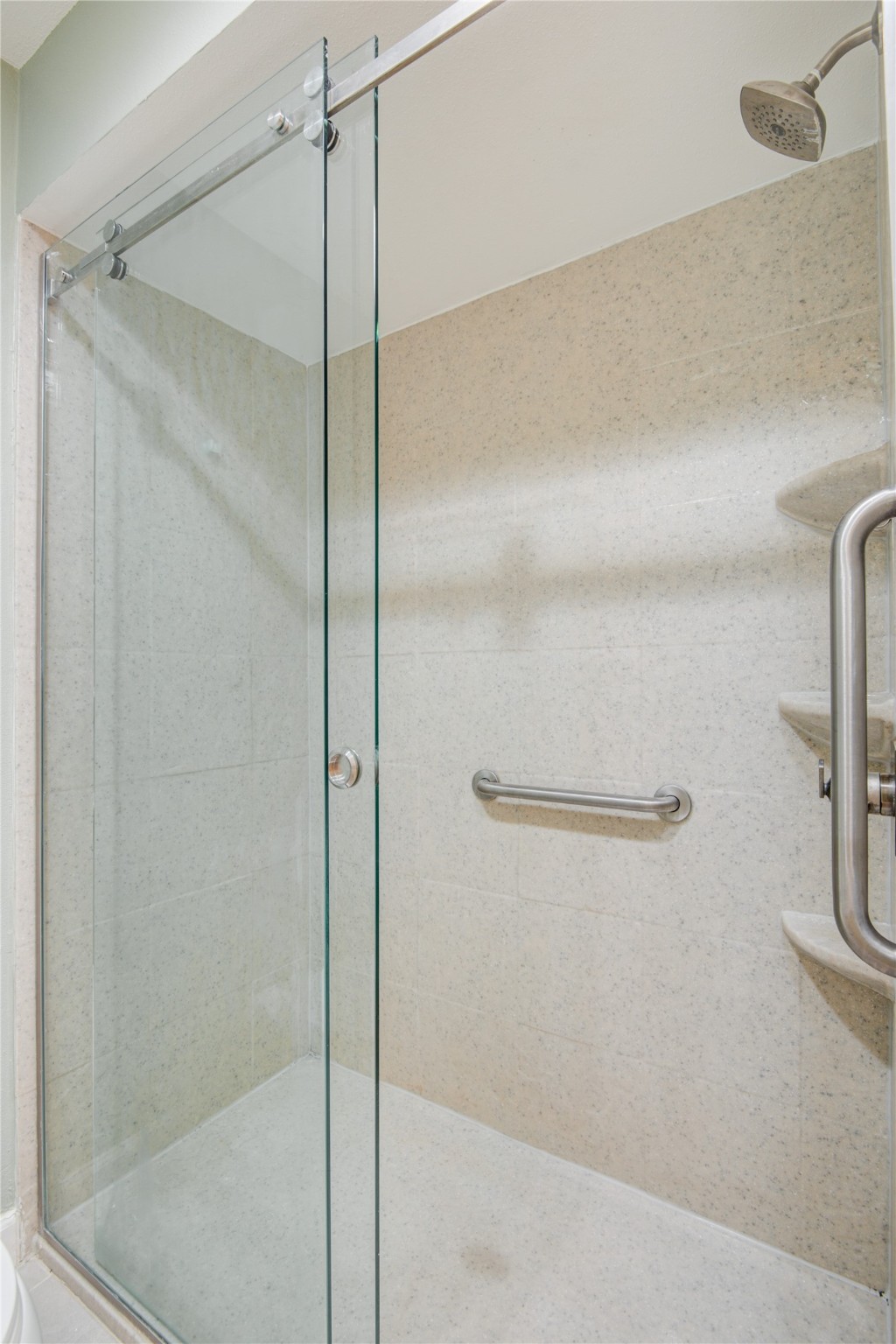 7449 Brompton Street, Unit 7449 Houston, TX 77025 - Photo 36 of 46 a bathroom with a glass shower door