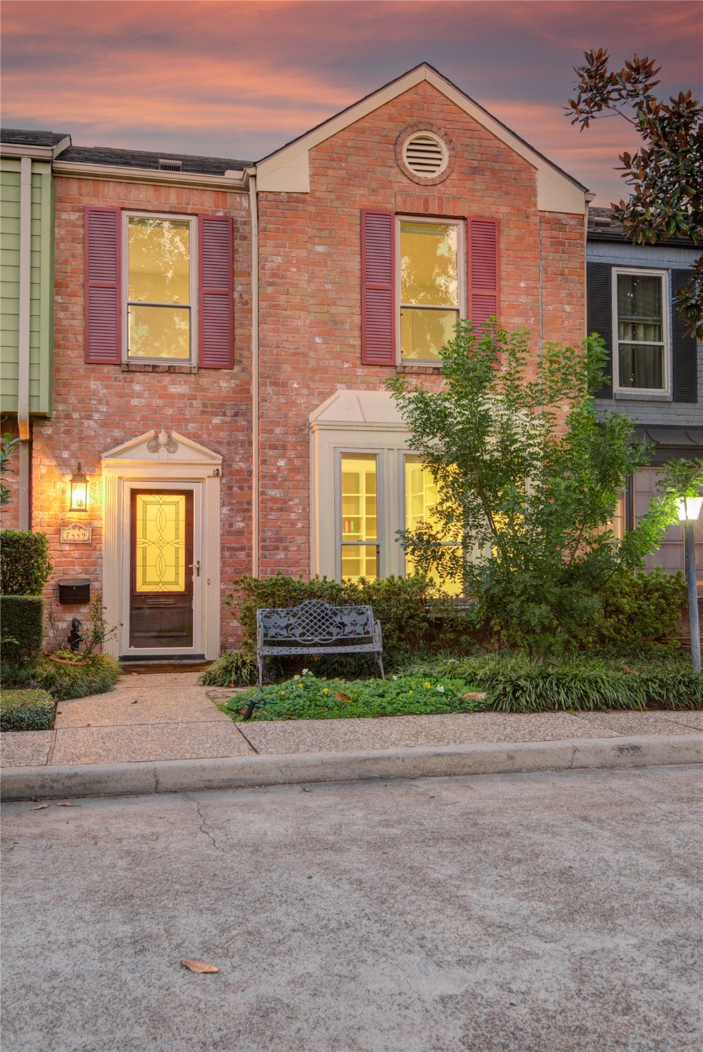 7449 Brompton Street, Unit 7449 Houston, TX 77025 - Photo 39 of 46 a front view of a house with garden