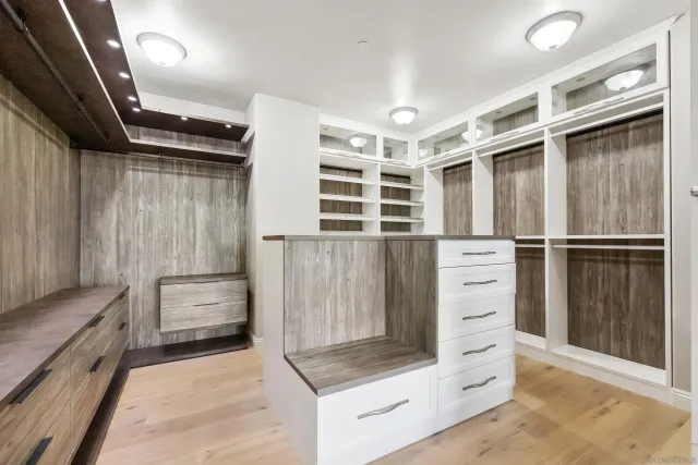 a kitchen with stainless steel appliances kitchen island granite countertop a refrigerator and a stove