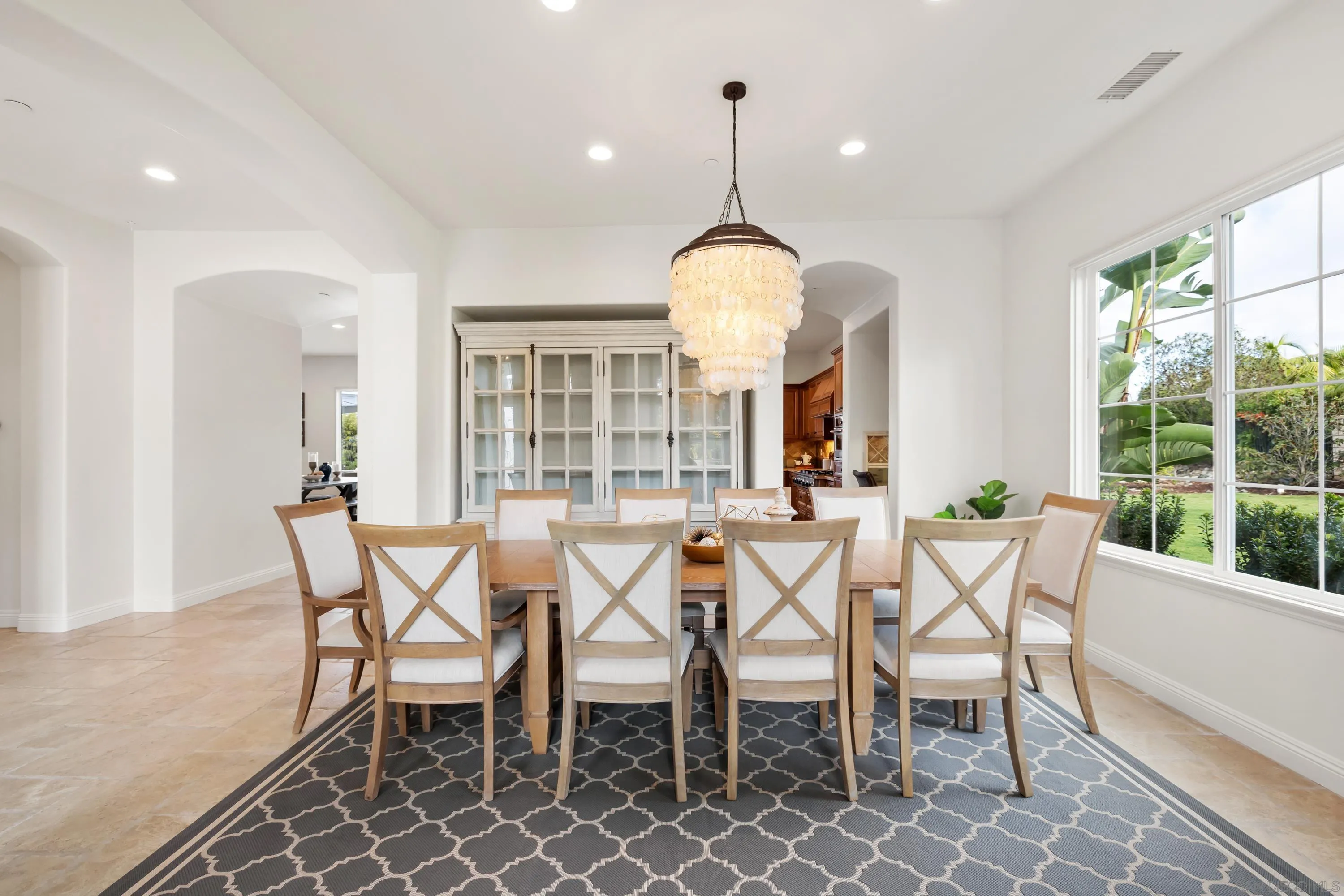 10055 Winecrest Road San Diego, CA 92127 - Photo 15 of 34 a view of a dining room with furniture wooden floor and chandelier
