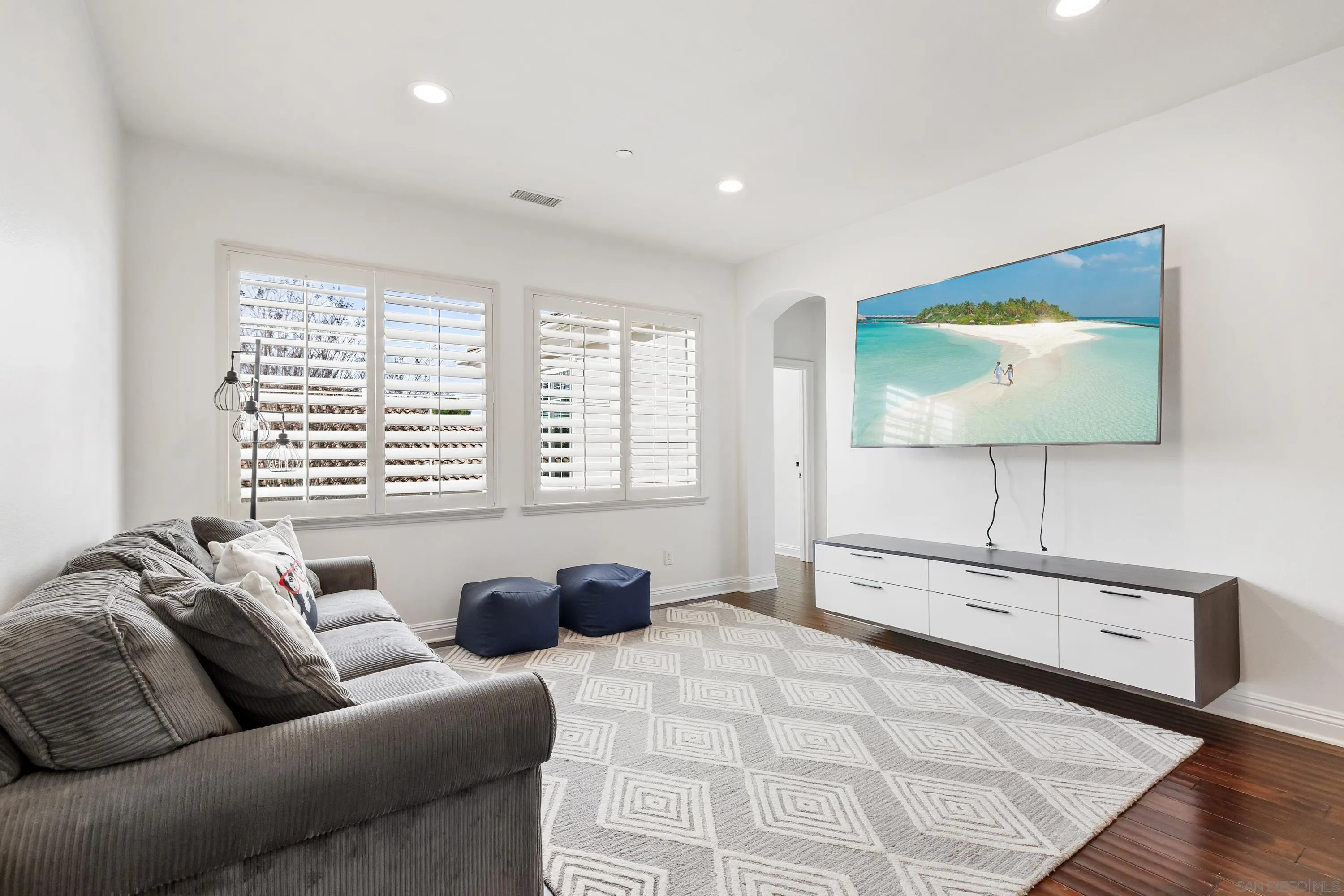 10055 Winecrest Road San Diego, CA 92127 - Photo 20 of 34 a living room with furniture and a flat screen tv
