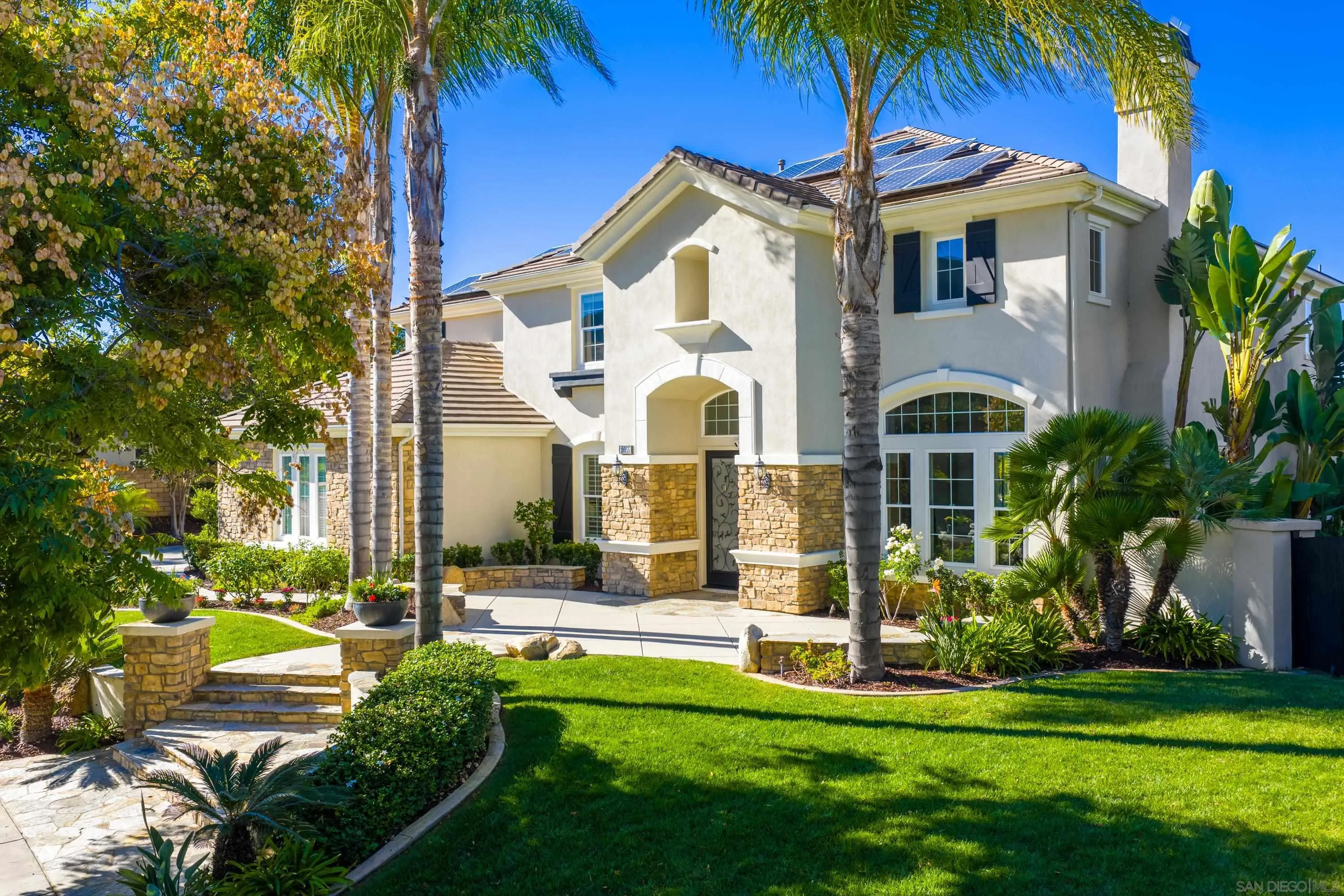 10055 Winecrest Road San Diego, CA 92127 - Photo 2 of 34 a front view of multi story residential apartment building with yard and green space