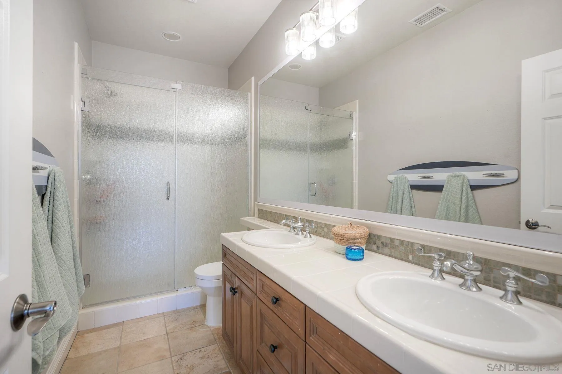 10055 Winecrest Road San Diego, CA 92127 - Photo 23 of 34 a bathroom with a sink a toilet and shower