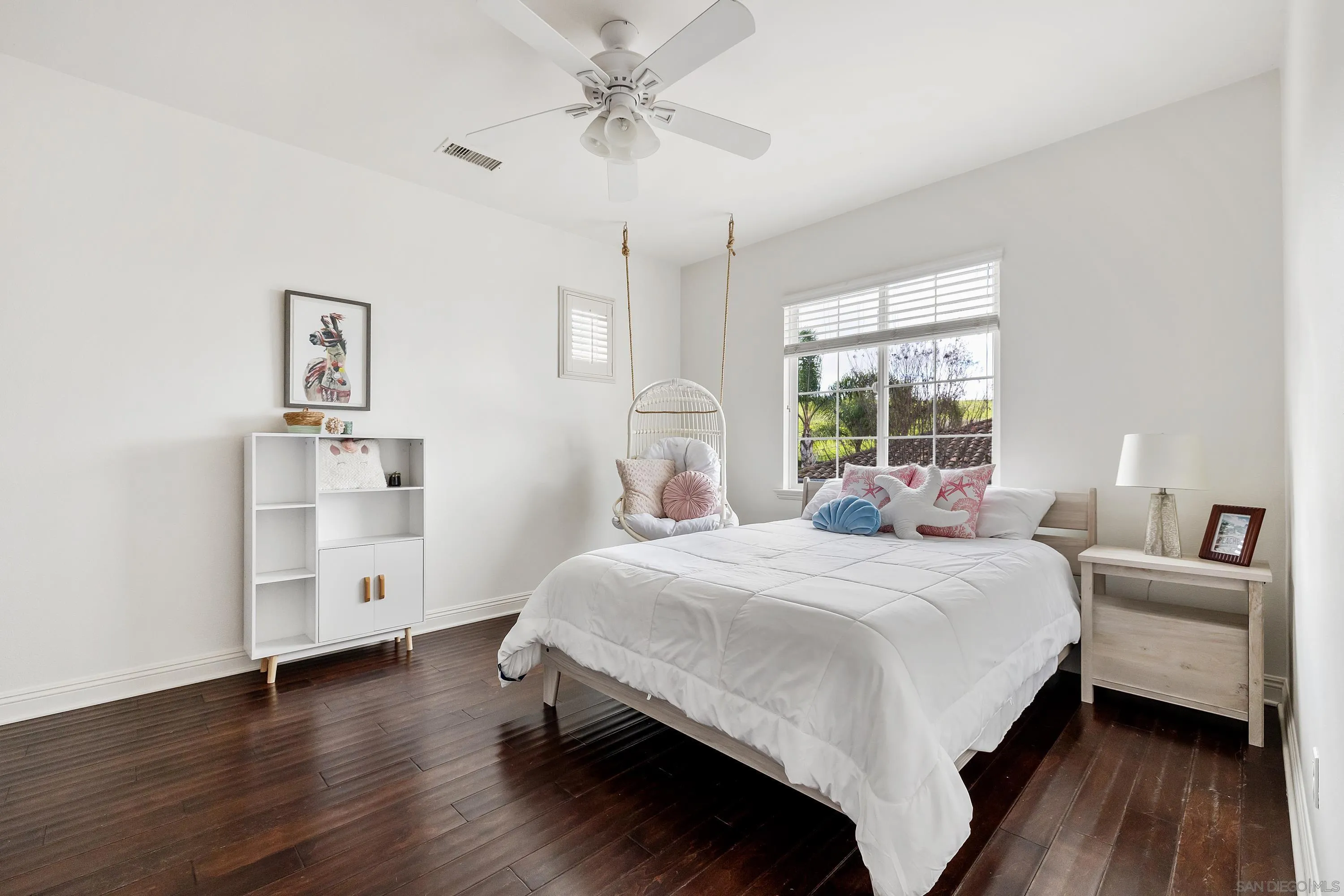 10055 Winecrest Road San Diego, CA 92127 - Photo 24 of 34 a bedroom with a bed and a chandelier