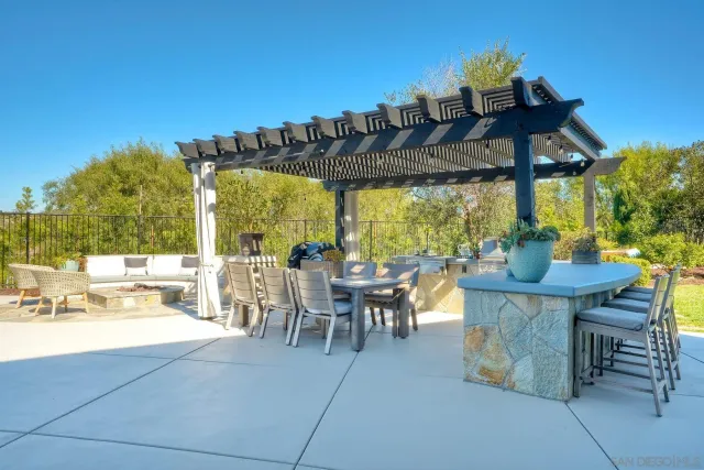 a view of a patio with a table chairs and a table