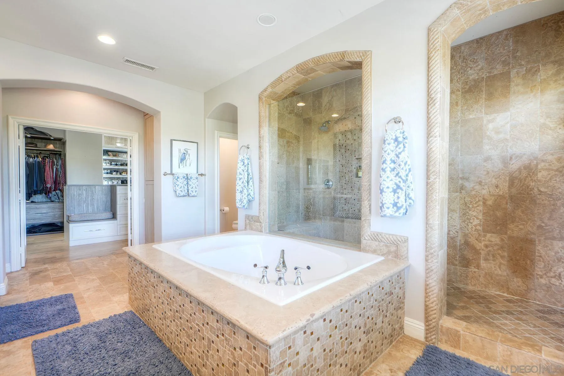 10055 Winecrest Road San Diego, CA 92127 - Photo 10 of 34 a bathroom with a bathtub and a shower