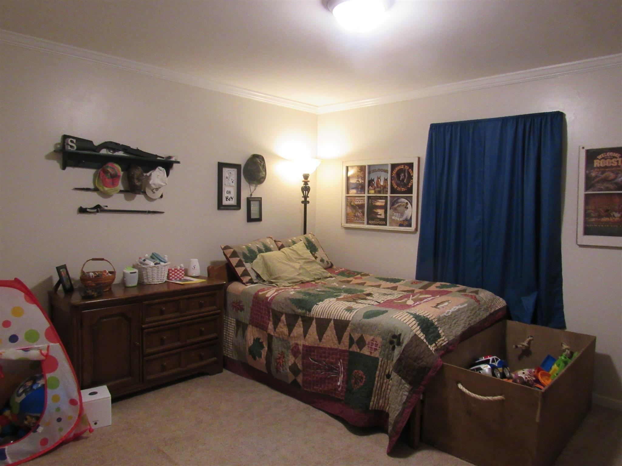 610 Cook Road Portland, TN 37148 - Photo 11 of 18 a bedroom with a bed and dresser