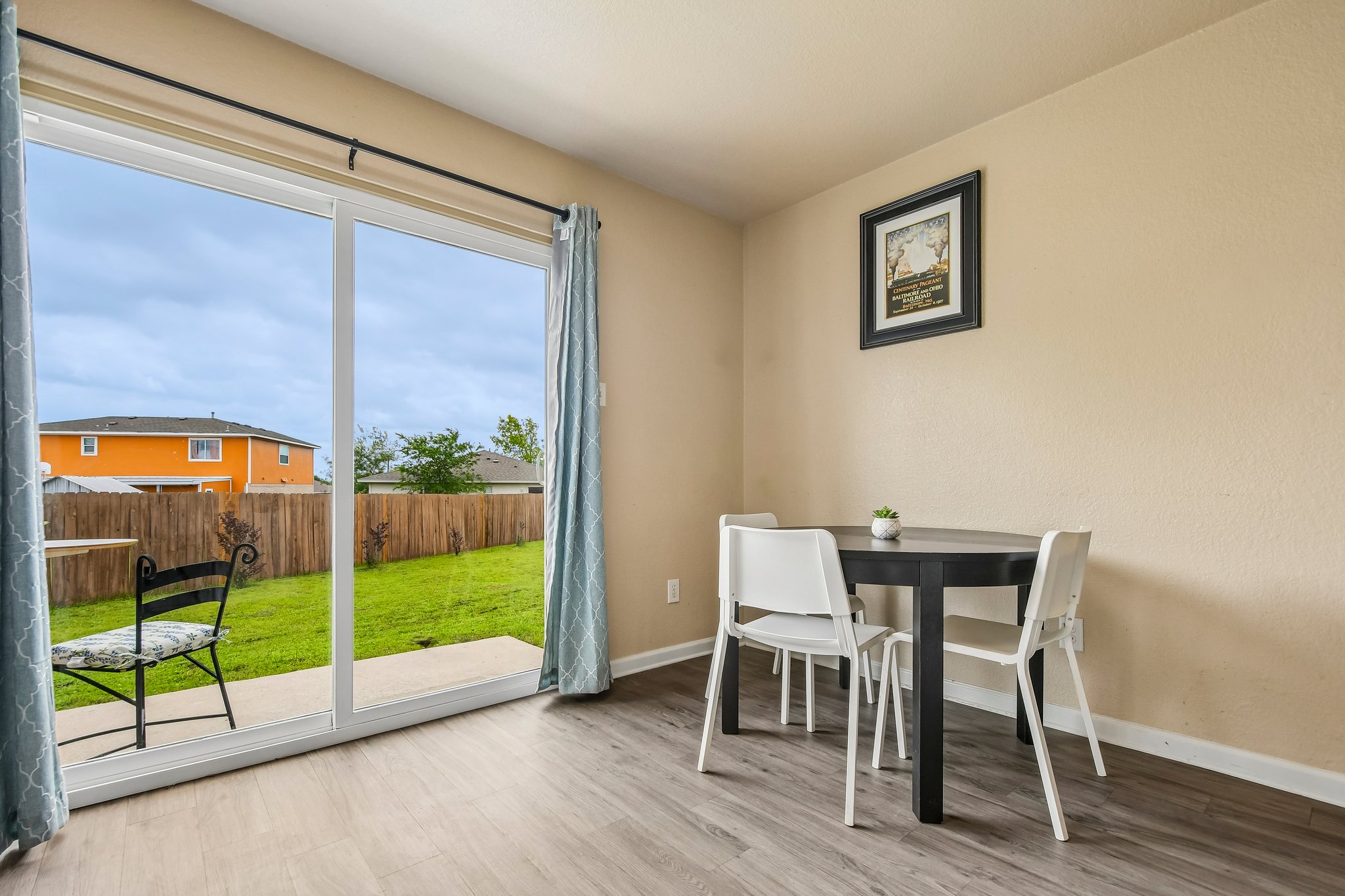 125 Mason Reed Cove Kyle, TX 78640 - Photo 14 of 39 a view of a dining room with furniture window and wooden floor