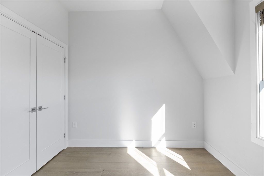 24 Rush Street, Unit G Somerville, MA 02145 - Photo 17 of 22 wooden floor in an empty room
