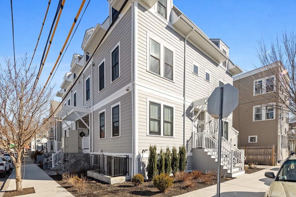 24 Rush Street, Unit G Somerville, MA 02145 - Photo 19 of 22 a view of a building along a street