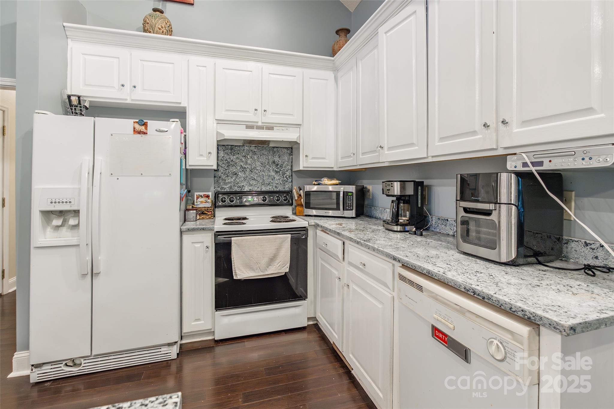 880 Columbia Road Chester, SC 29706 - Photo 12 of 40 a kitchen with stainless steel appliances granite countertop a refrigerator sink and cabinets