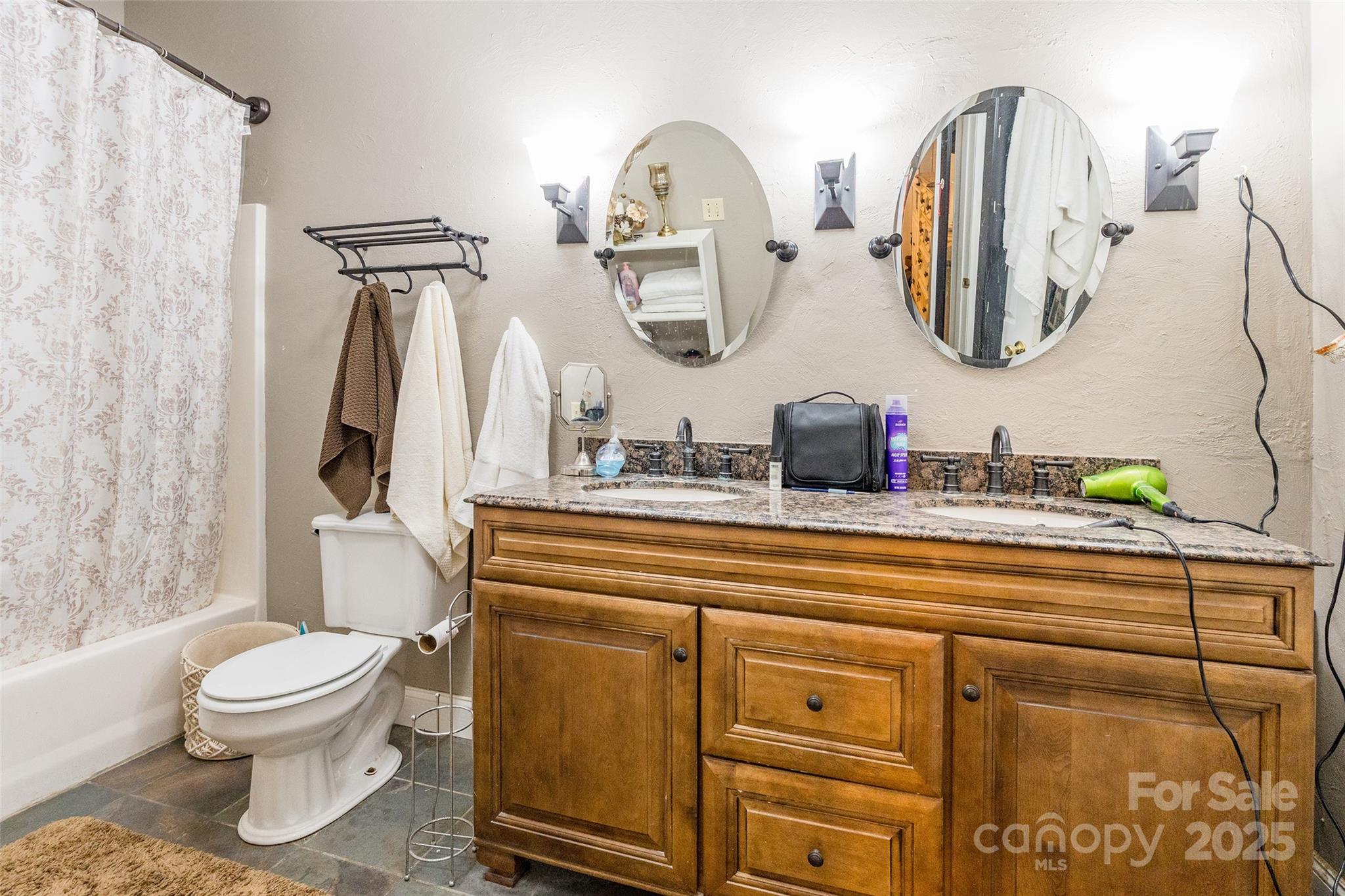 880 Columbia Road Chester, SC 29706 - Photo 18 of 40 a bathroom with a toilet sink and mirror