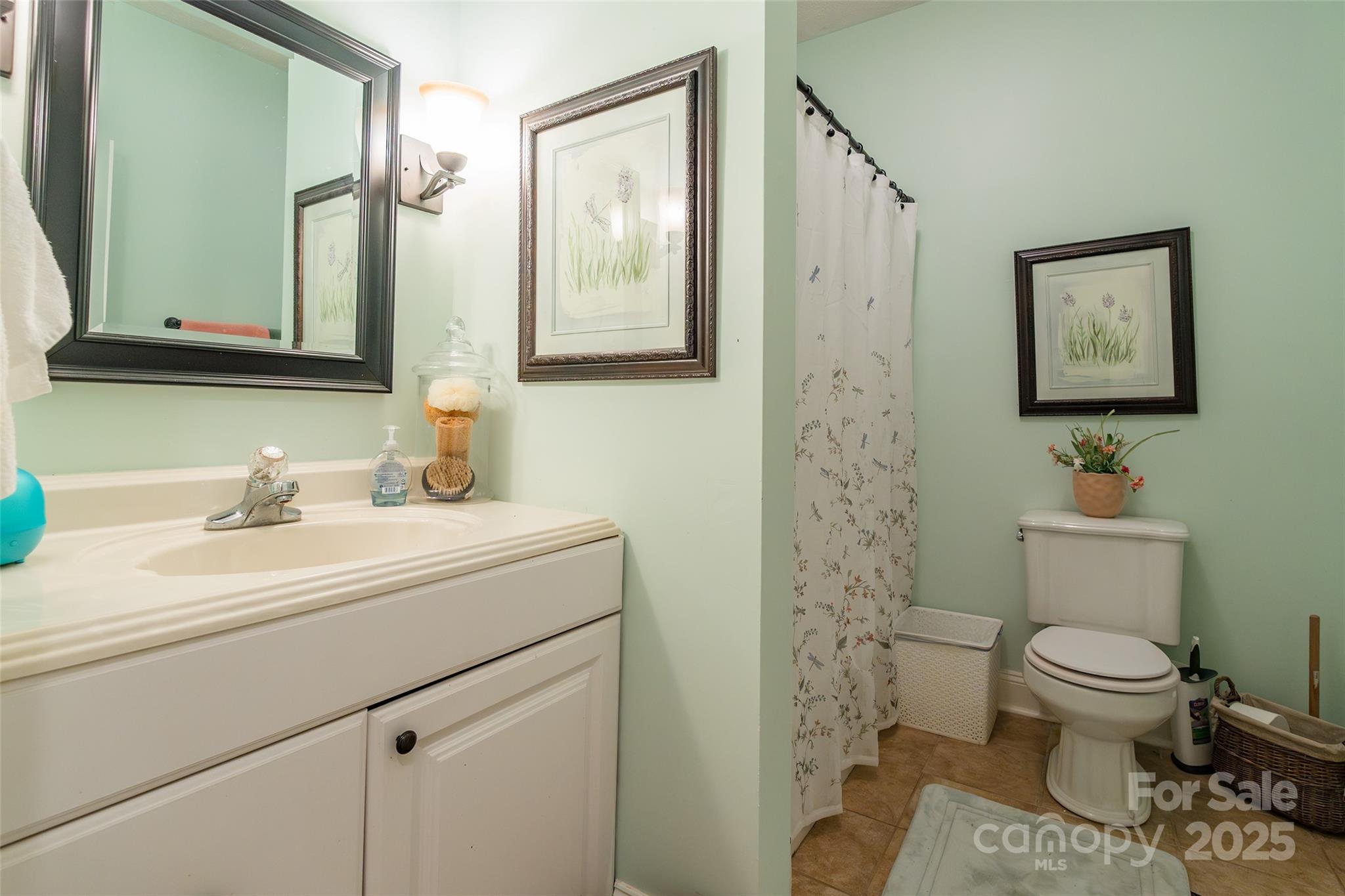 880 Columbia Road Chester, SC 29706 - Photo 22 of 40 a bathroom with a toilet sink and mirror