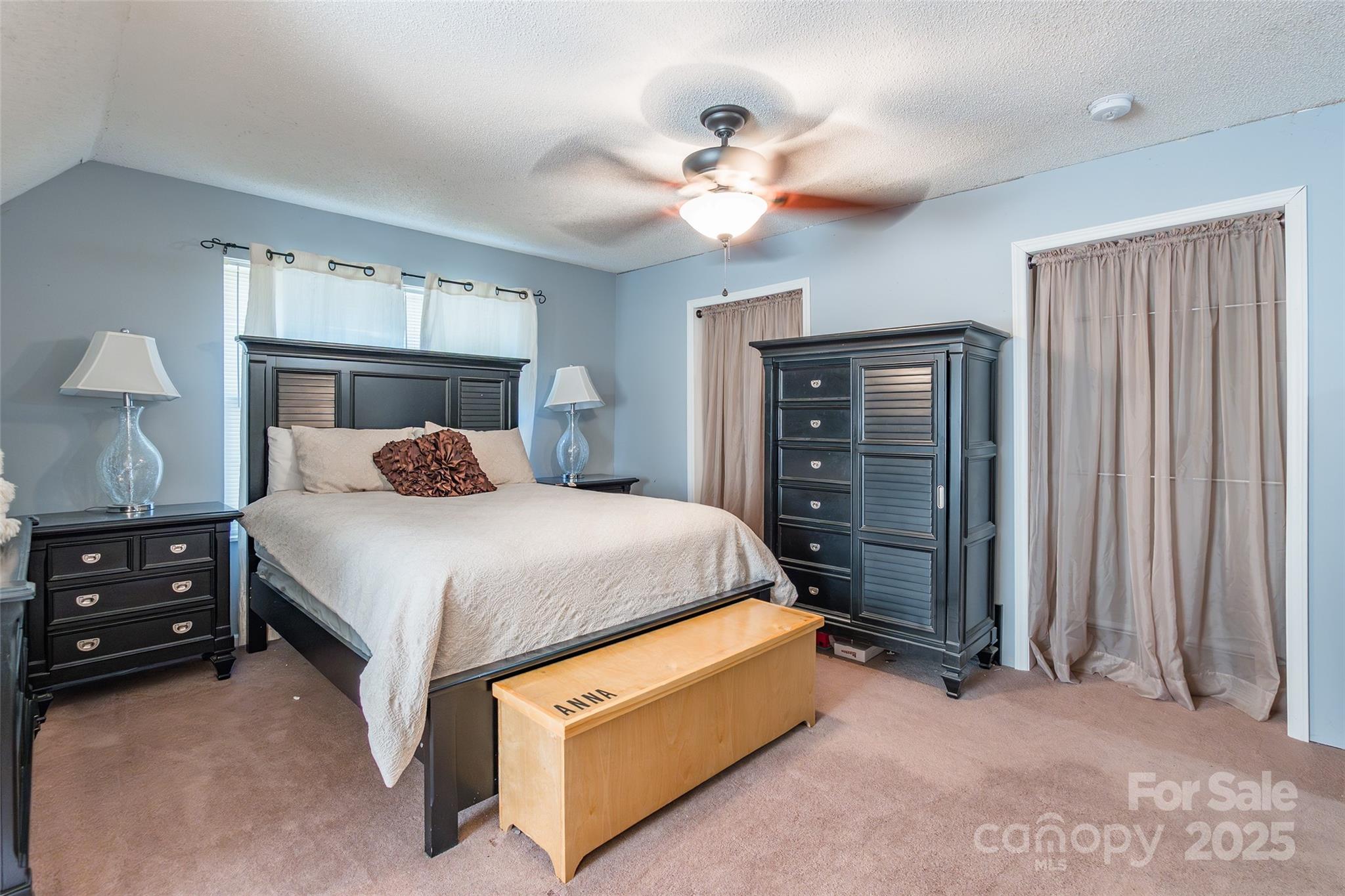 880 Columbia Road Chester, SC 29706 - Photo 24 of 40 a bedroom with a bed and a chandelier
