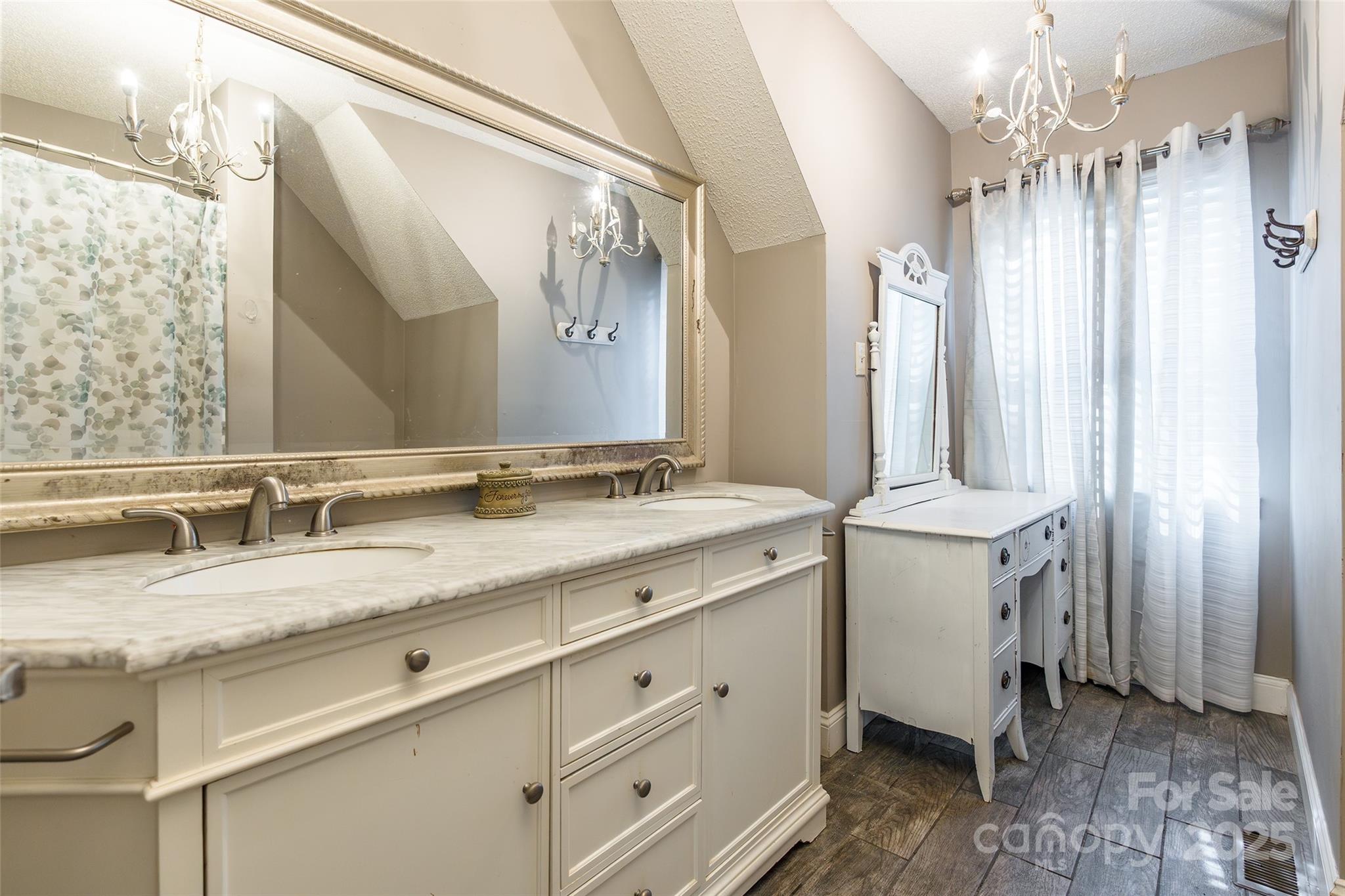 880 Columbia Road Chester, SC 29706 - Photo 26 of 40 a bathroom with double sink and a mirror