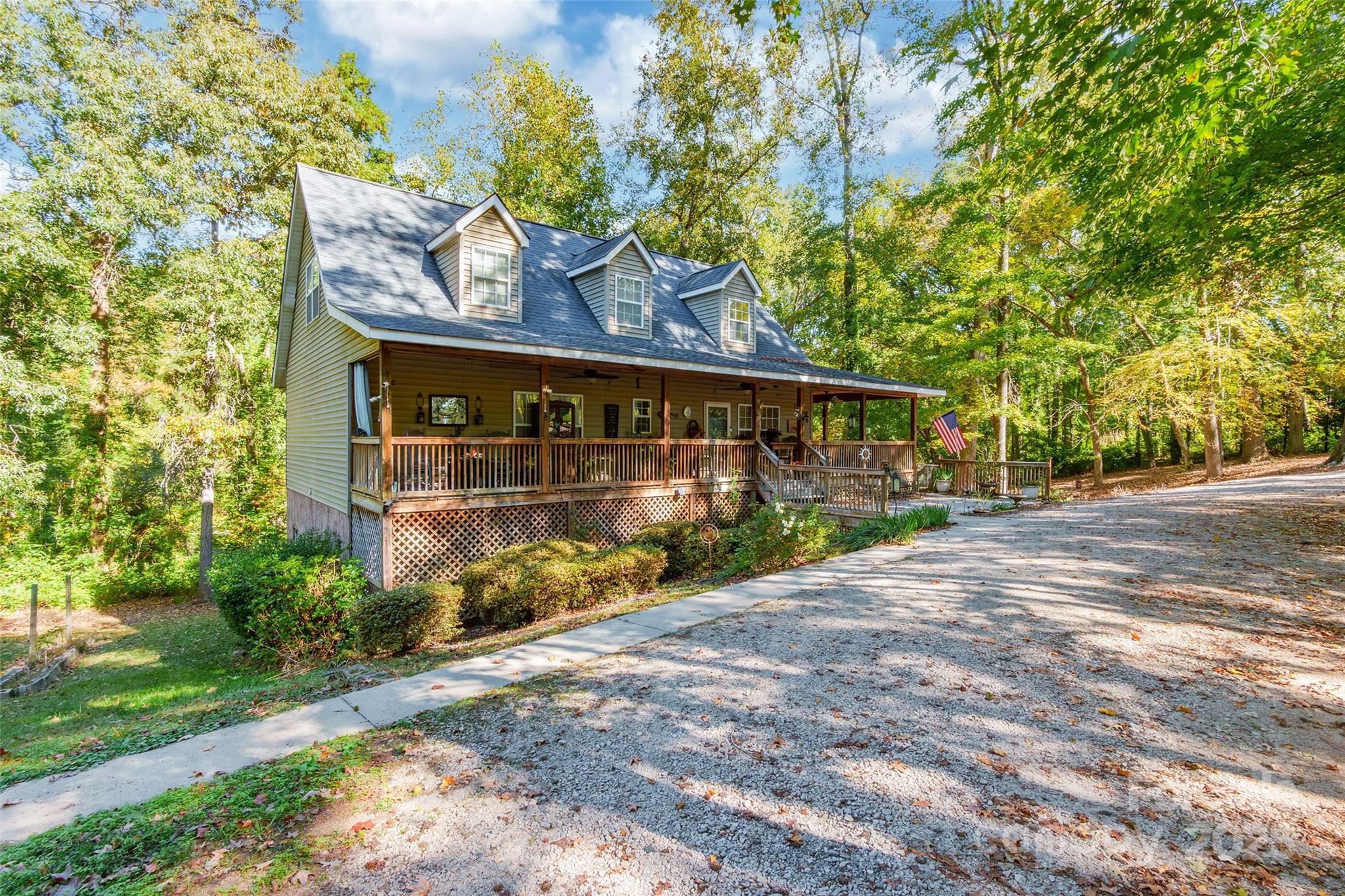 880 Columbia Road Chester, SC 29706 - Photo 3 of 40 a view of a street sign under a large tree