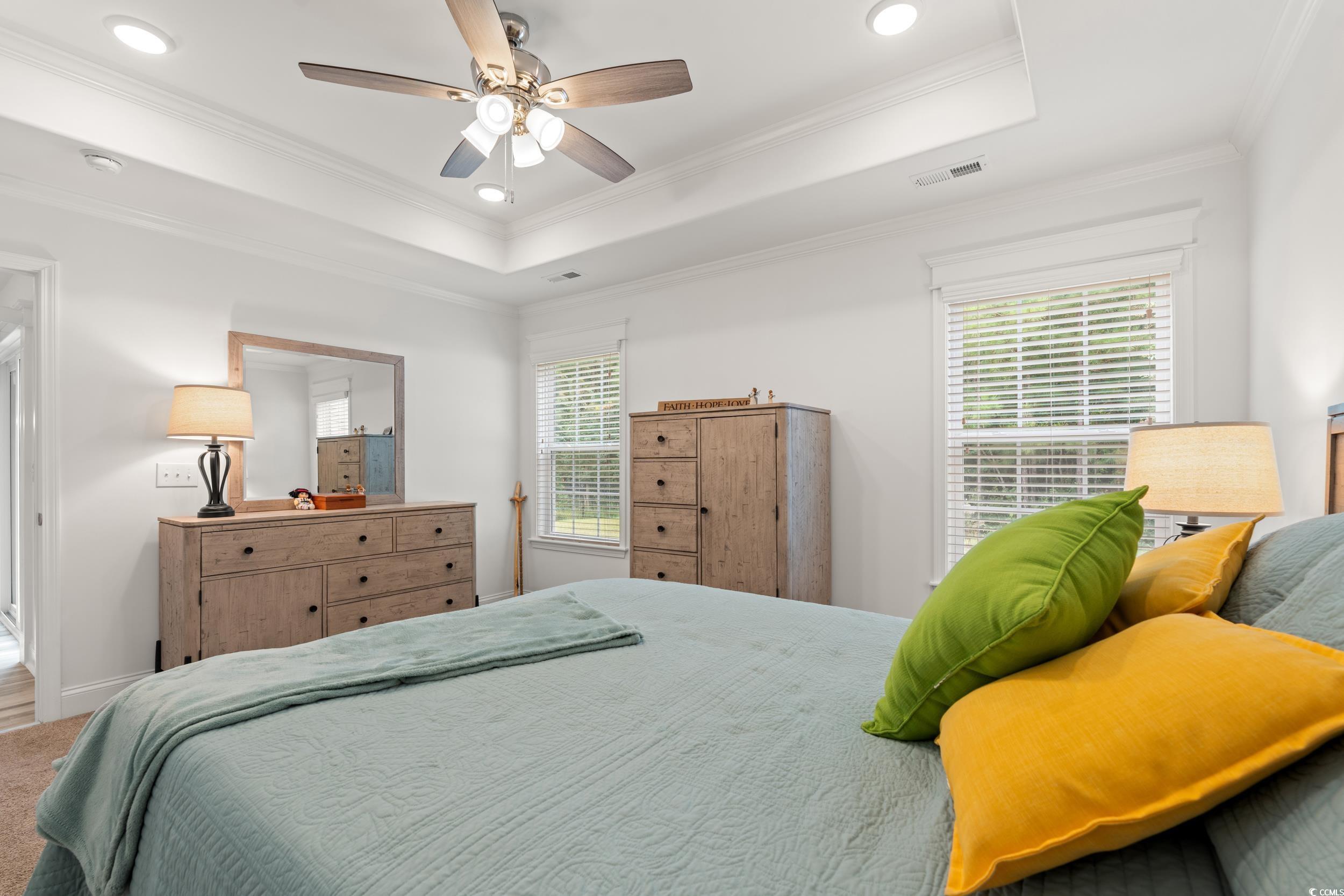 156 Hamilton Way Conway, SC 29526 - Photo 14 of 36 Carpeted bedroom featuring a tray ceiling, crown molding, a ceiling fan, and recessed lighting