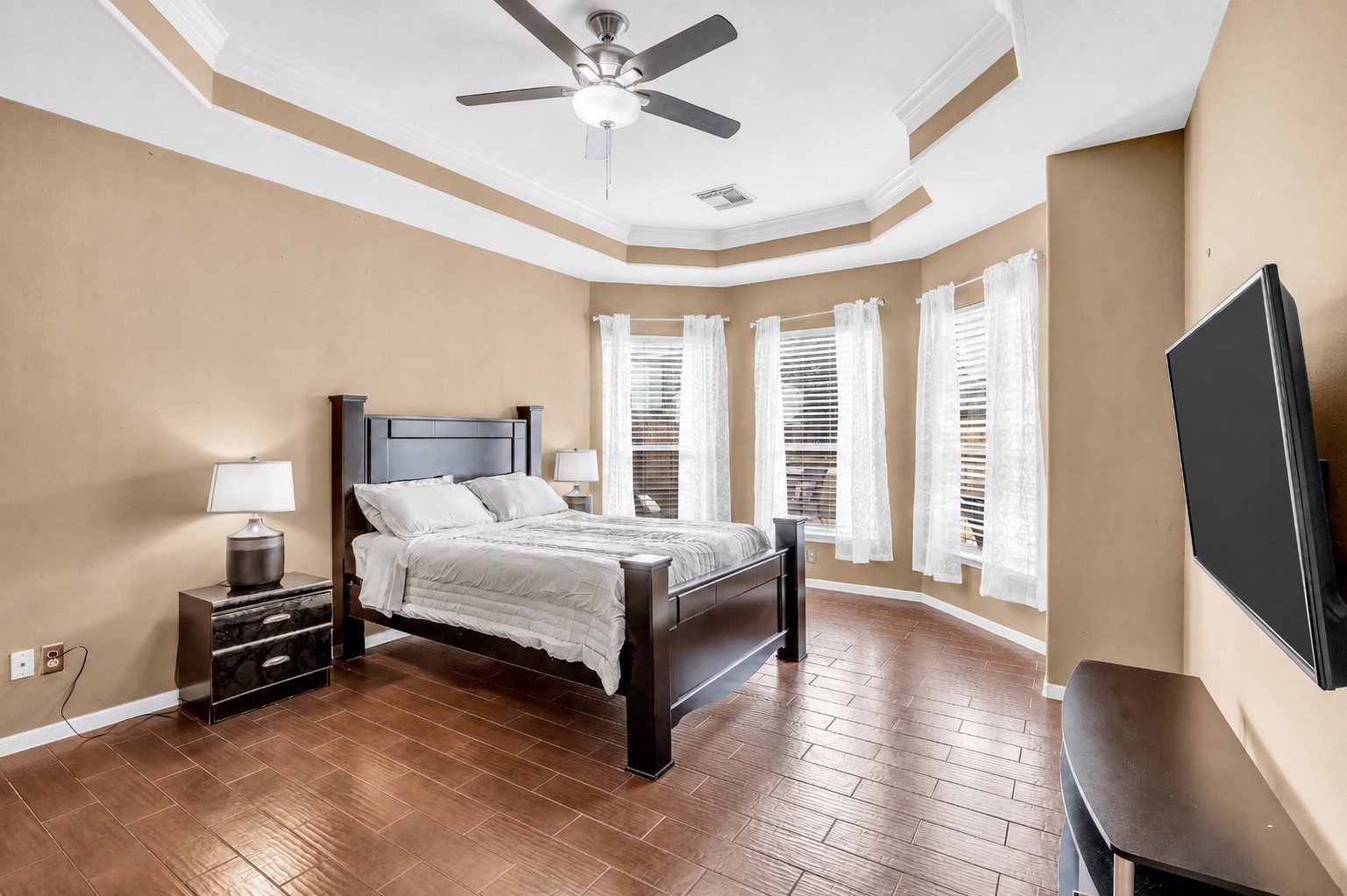611 River Delta Lane Rosenberg, TX 77469 - Photo 6 of 39 a spacious bedroom with a bed and a flat screen tv