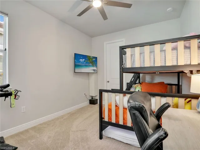 a bedroom with furniture and a window