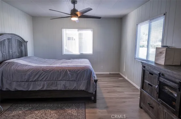 a bedroom with a bed and a chair