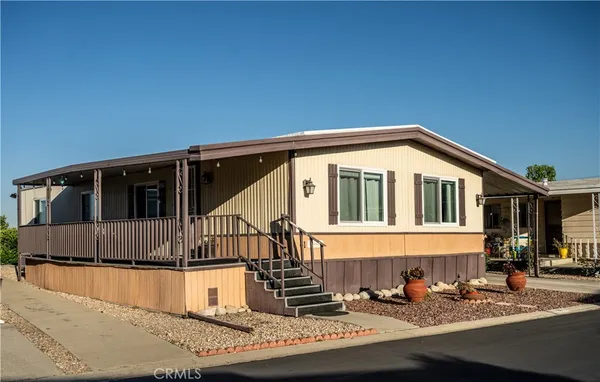 a view of a house with wooden fence
