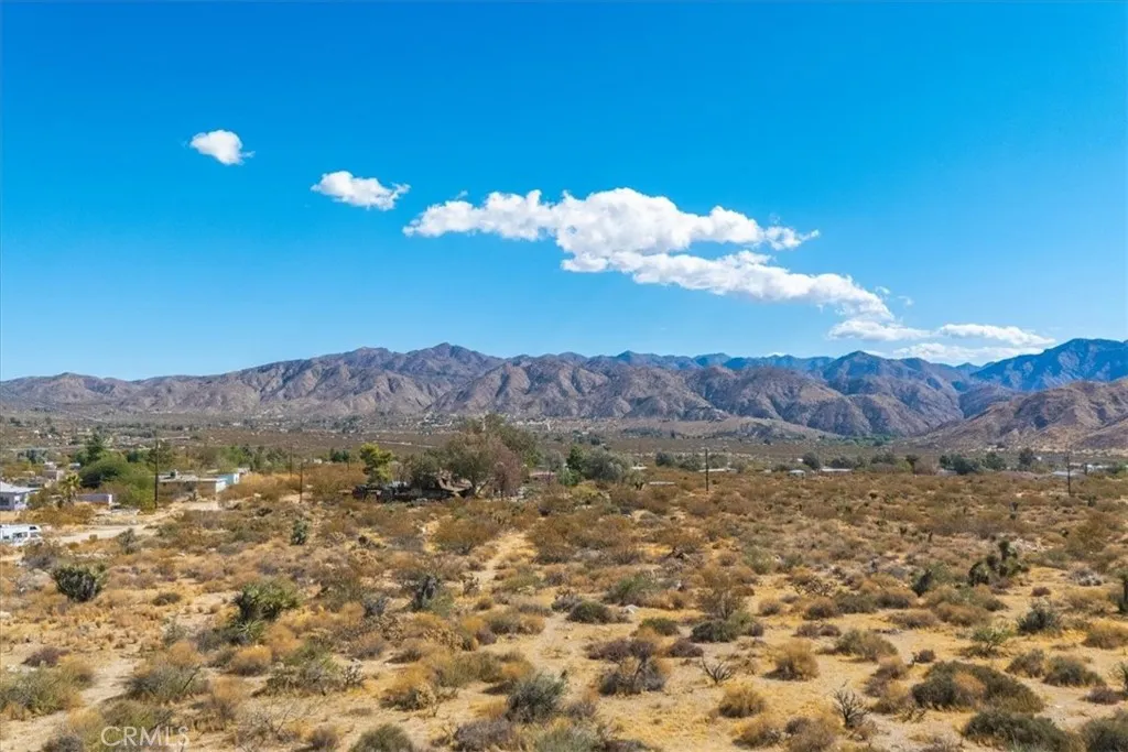 9457 Fobes Morongo Valley Morongo Valley, CA 92256 - Photo 29 of 34 a view of a sky with mountains in the background