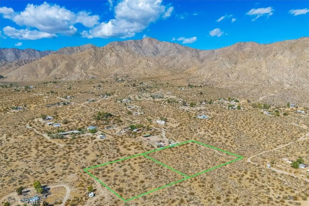 9457 Fobes Morongo Valley Morongo Valley, CA 92256 - Photo 7 of 34 a view of a dry yard with mountains in the background