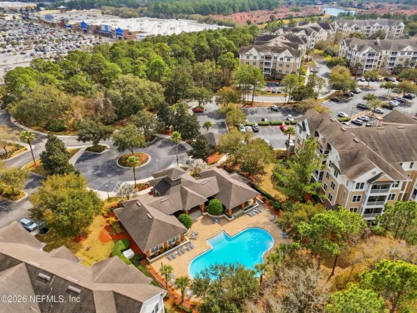 an aerial view of residential house with outdoor space and swimming pool