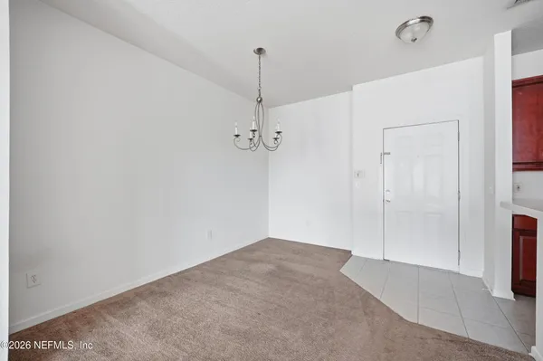 a view of a room with a hallway