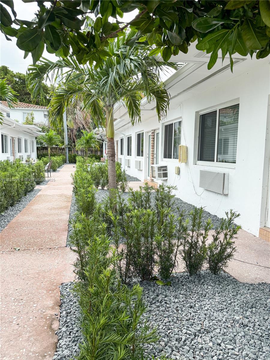 800 85th Street, Unit 794 Miami Beach, FL 33141 - Photo 12 of 13 a front view of a house with a garden