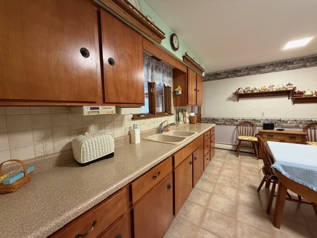 5563 Stone Drive Clinton, IL 61727 - Photo 11 of 34 a kitchen with kitchen island granite countertop a sink and a stove