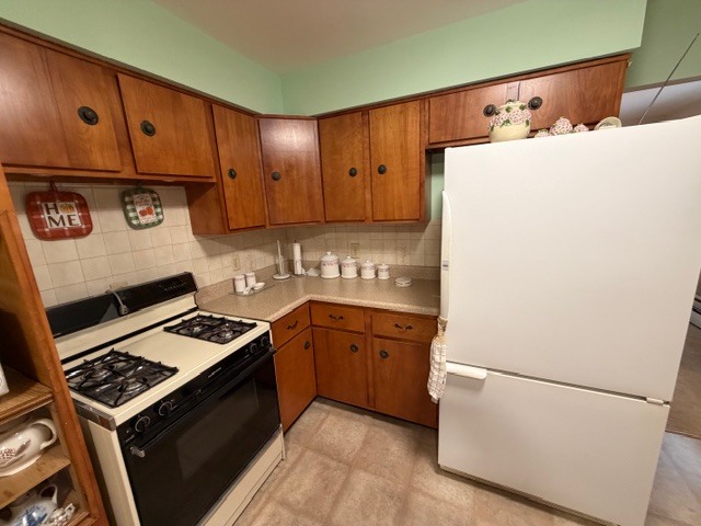 5563 Stone Drive Clinton, IL 61727 - Photo 13 of 34 a kitchen with stainless steel appliances granite countertop a refrigerator stove a sink and dishwasher