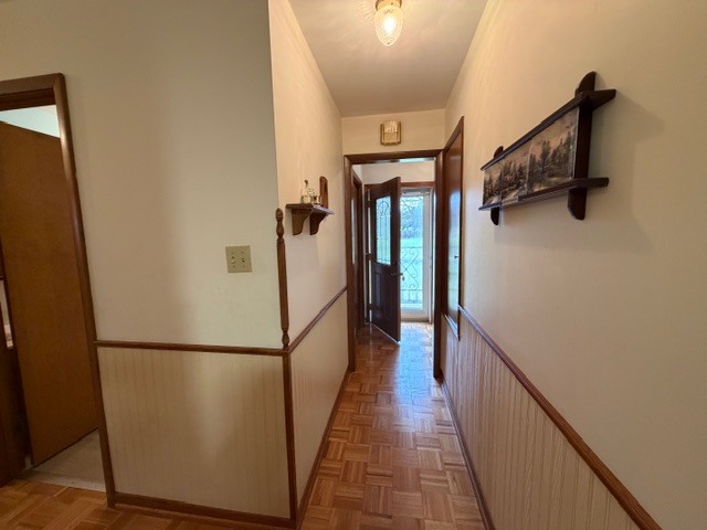 5563 Stone Drive Clinton, IL 61727 - Photo 15 of 34 a view of a hallway with wooden floor and staircase