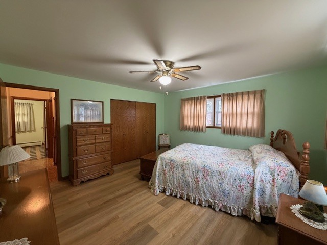 5563 Stone Drive Clinton, IL 61727 - Photo 19 of 34 a bedroom with a bed and wooden floor